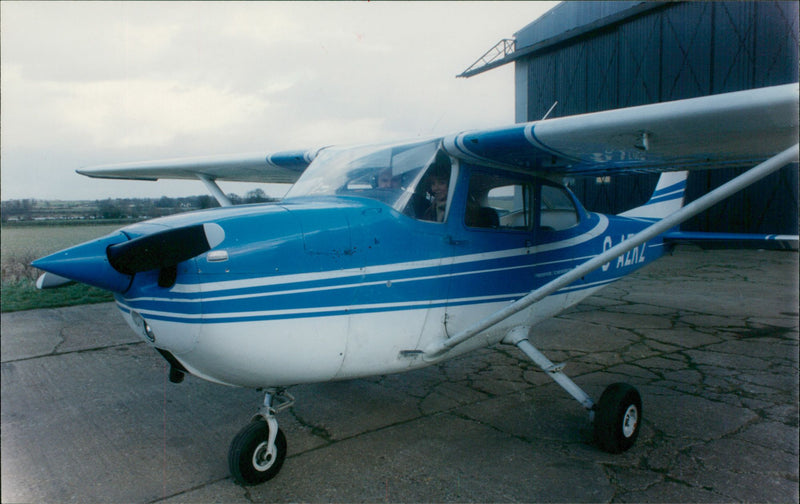 Mr. Shepherd Rose give a quick test to ensure the Cessna 172. - Vintage Photograph