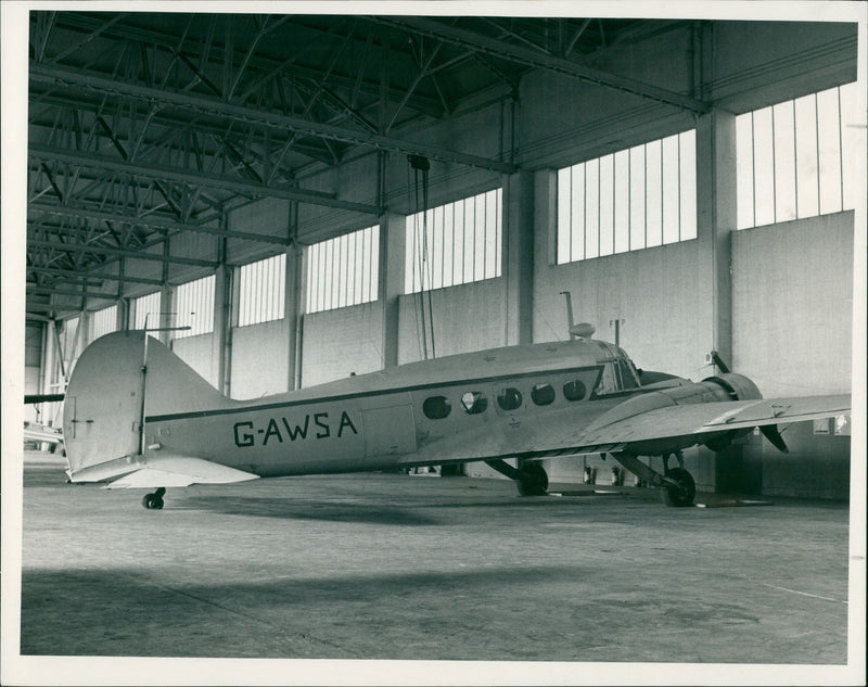 The old ex-RAF Avro Anson aircraft which has stood in a hangar at Norwich Airport. - Vintage Photograph