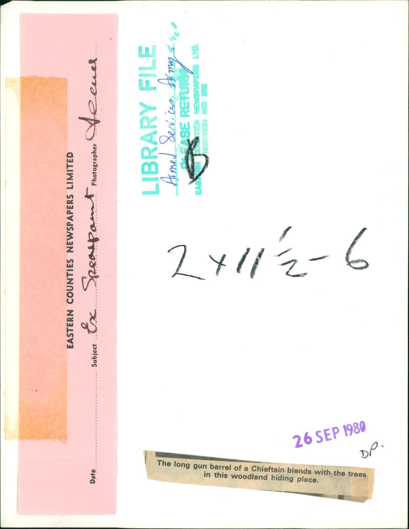 The long gun barrel of a chieftain blends in woodland. - Vintage Photograph