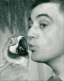 Birds: Parrot: Joe Silvester and his parrot. - Vintage Photograph
