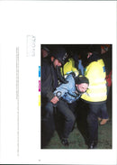 A animal man protester caught by police. - Vintage Photograph