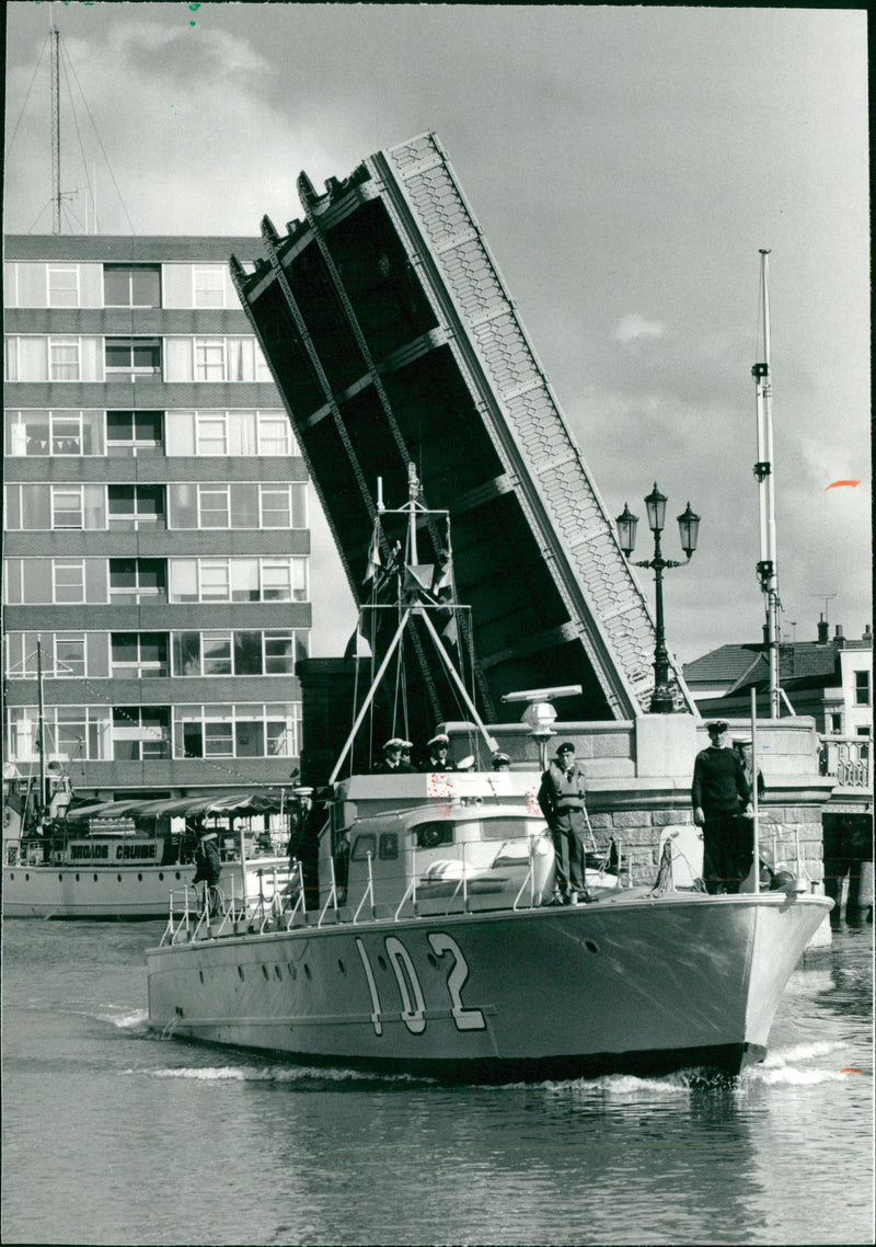 A photo of MTB 102 passes through the bridge. - Vintage Photograph