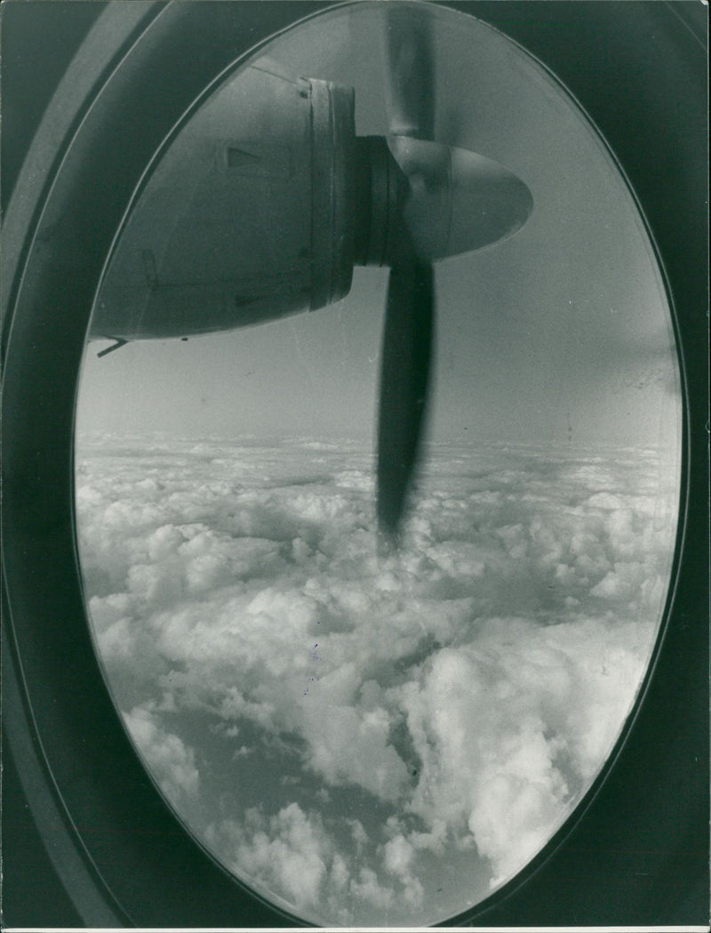 High above the clouds the Fokker Friendship wings its way to Aberdeen - Vintage Photograph