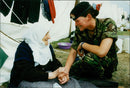 Private Julie Dick with refugee from Kosovo. - Vintage Photograph