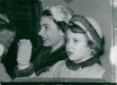 Queen Elizabeth and Princess Anne wave from the car on their way to Kings Cross - Vintage Photograph