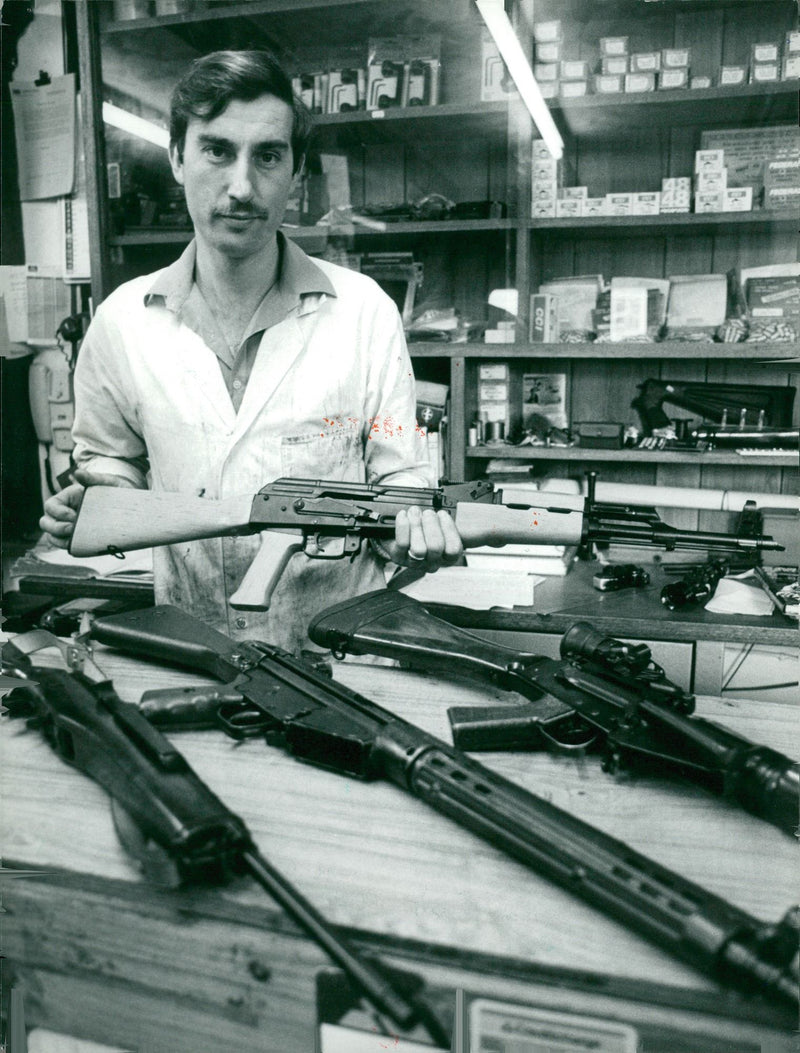 Weapons: Tony Buckland holding a Kalashnikov rifle Ak47 - Vintage Photograph