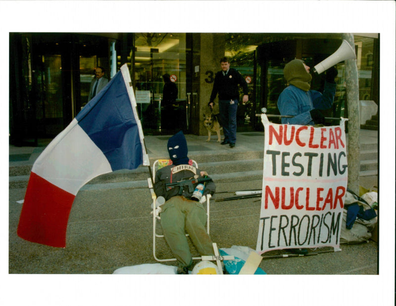 A dummy figure of French President Jacques chirac with a toy machine gun. - Vintage Photograph