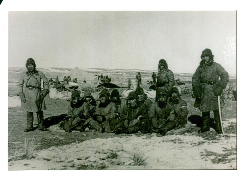 RooseThis photo showing three Japanese army soldiers guarding eight Chinese prisoners in Mongolia. - Vintage Photograph
