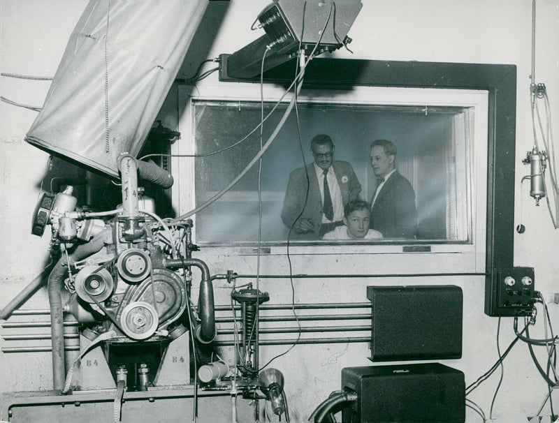 Volvo's engineer takes the pulse on the Volvo engine in the engine lab - Vintage Photograph