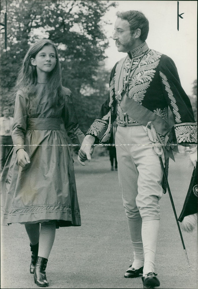 Anne-Marie Mallik walking hand in hand with Peter Sellers - Vintage Photograph