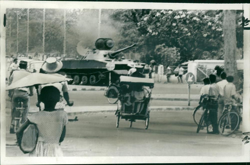 A tank standing guard outside the Merdeka Palace in Jakarta. - Vintage Photograph