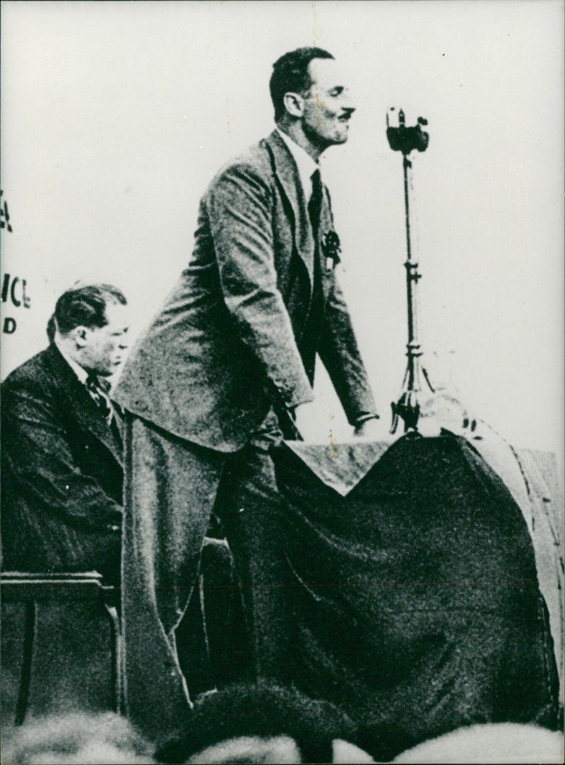 Sir. Oswald Mosley addresses a fascist rally in the 1930s. Behind him on the platform is Ted "Kid" Lewis - Vintage Photograph