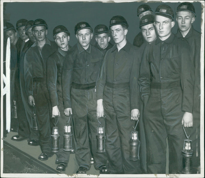 Miners awaiting their turn to go home. - Vintage Photograph