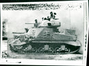 A tank from eighth army advancing through the desert at el alamein. - Vintage Photograph