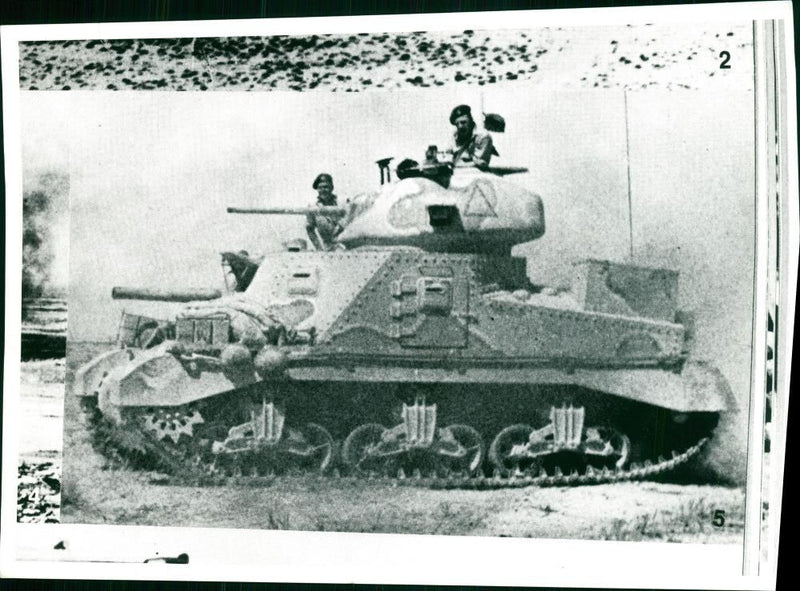 A tank from eighth army advancing through the desert at el alamein. - Vintage Photograph