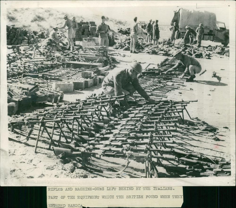 Rifles and machine guns left behind by the Italian. - Vintage Photograph