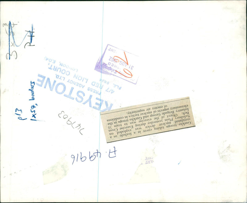 Gurkha troops taking cover in a foxhole as a simulated nuclear device was exploded on Salisbury Plain during Exercise Cross Belt. - Vintage Photograph