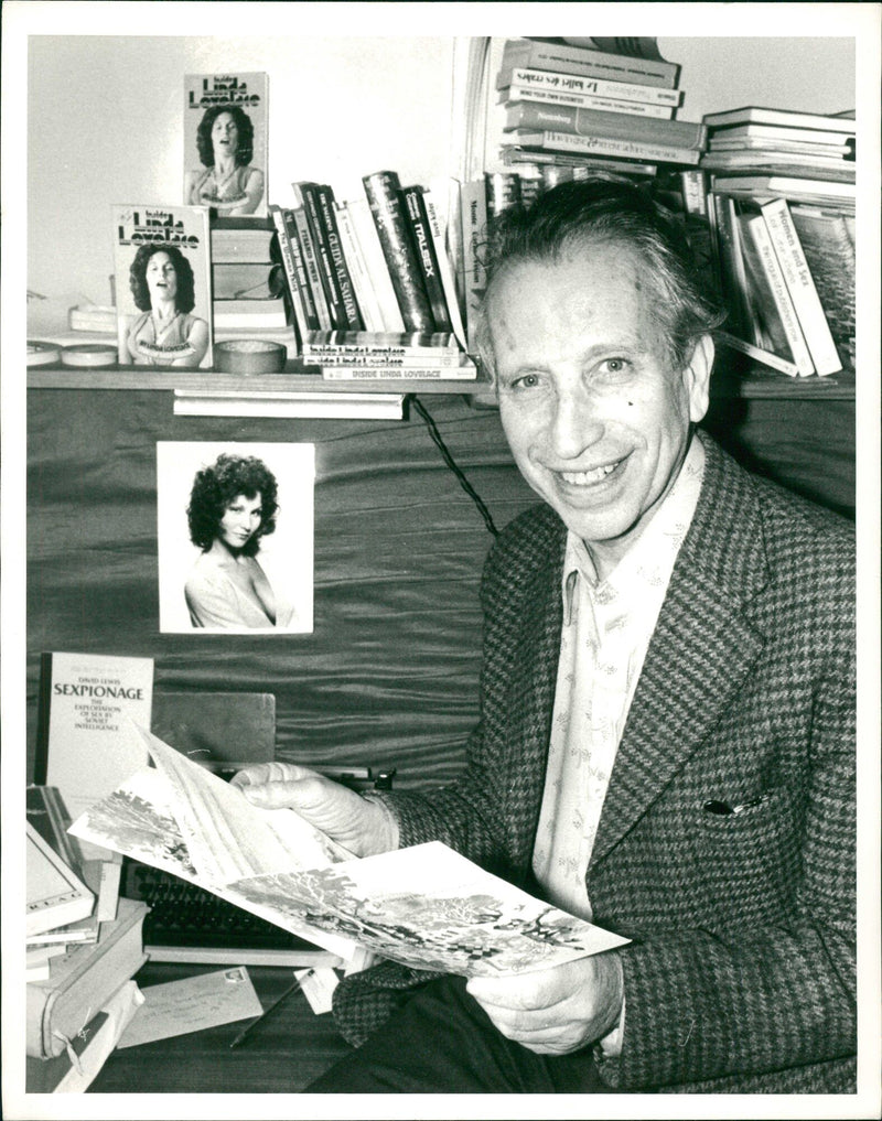 Johannes Hanau: He sits in his Soho Office with a copy of the book - Vintage Photograph