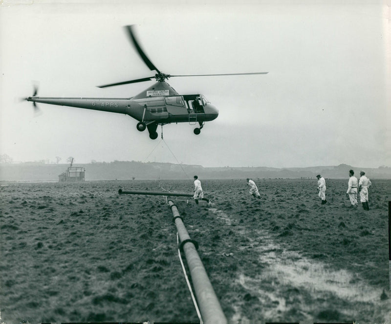 An helicopter above the field. - Vintage Photograph