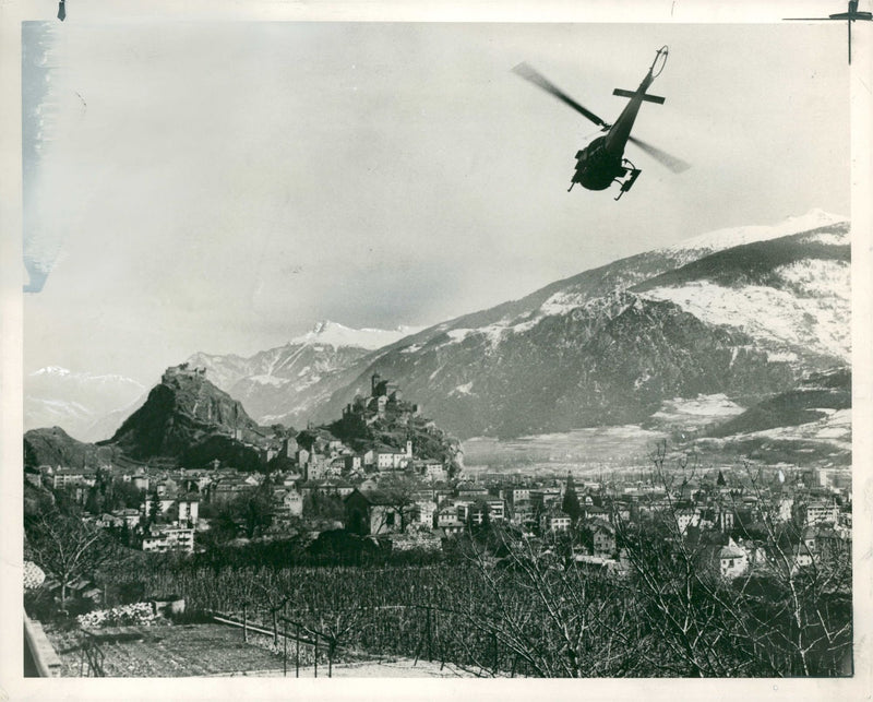 A helicopter flying Zermatt to Sion. - Vintage Photograph