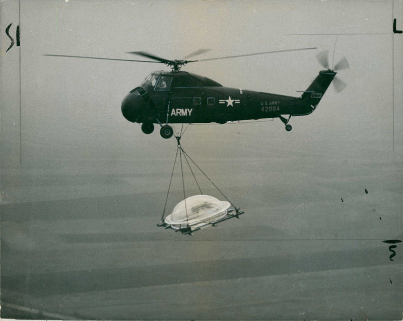 Helicopter carrying the cupola from Nauheim to Mussbach. - Vintage Photograph