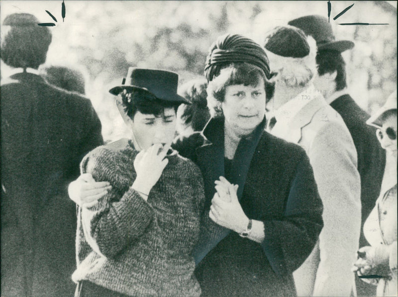 A Consoling arm for 18 years old miss nicola laitner as she left the graveside. - Vintage Photograph