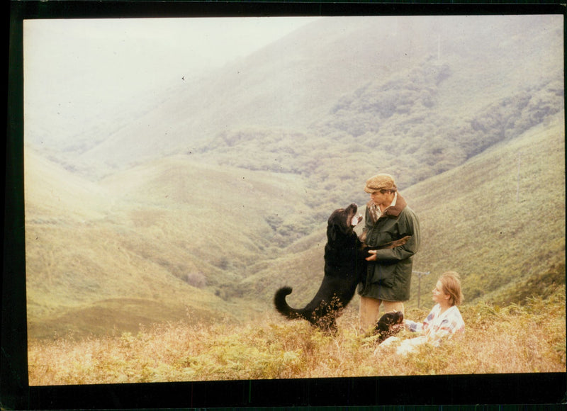 Ranulph Fiennes with his wife and their dogs. - Vintage Photograph