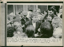 Paul McCartney greets fans during a mini-invasion of autograph seekers at the Elswick Street film location of "Bread" in Liverpool. - Vintage Photograph