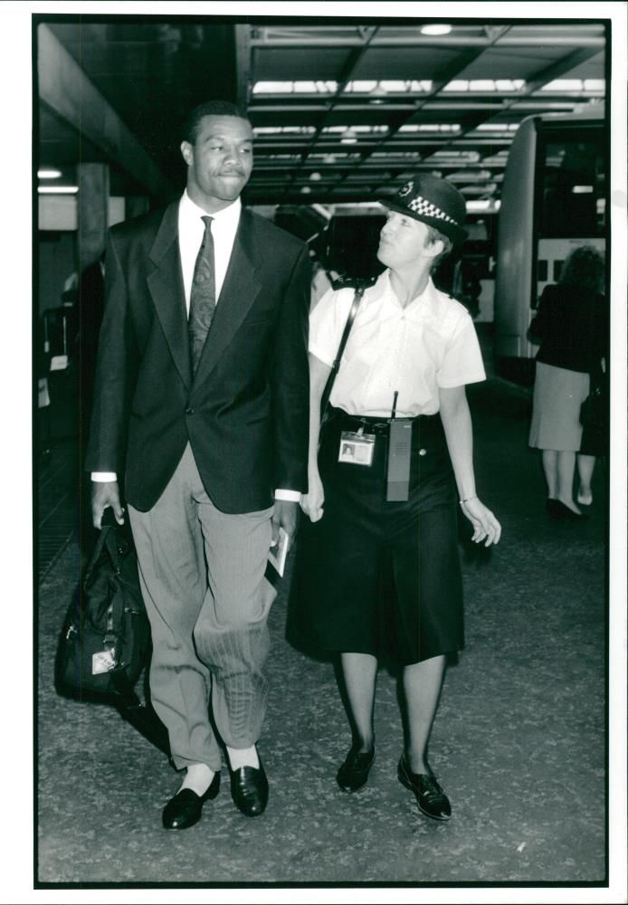 American football quarterback Randall Cunningham with P.c. Elaine Nicholls - Vintage Photograph