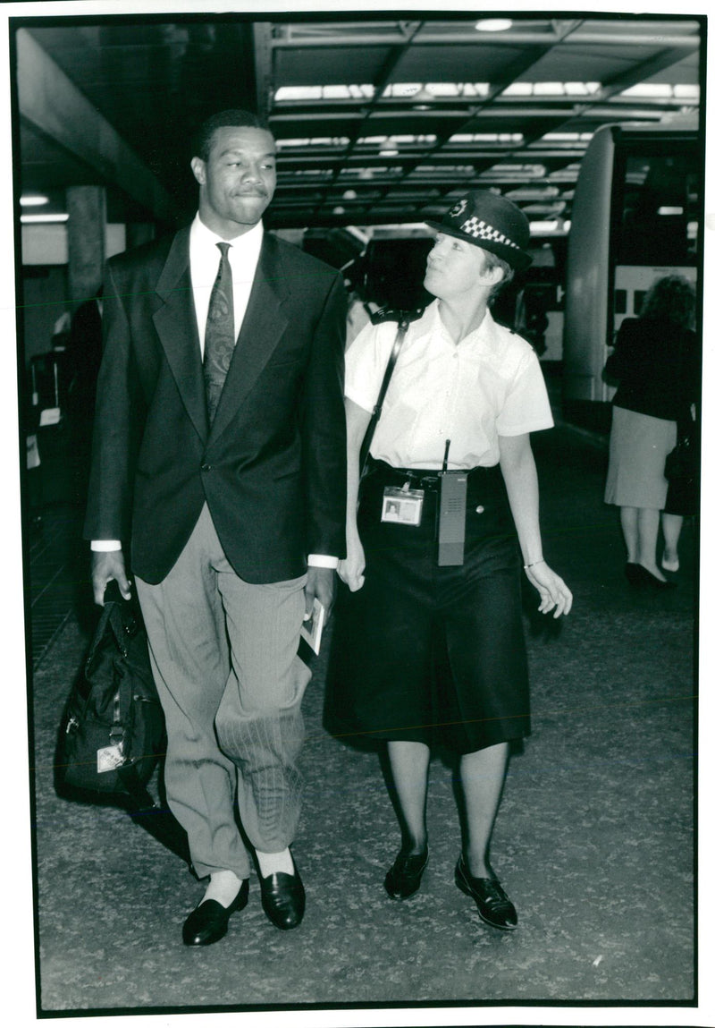 American football quarterback Randall Cunningham with P.c. Elaine Nicholls - Vintage Photograph