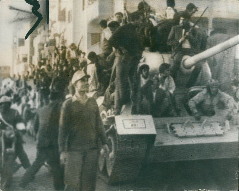 Suez Canal Fighting egyptians sitting one of the tanks. - Vintage Photograph