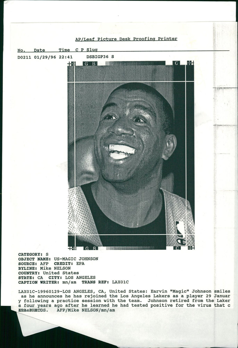 Magic Johnson American basketball player smiles as he announces he has rejoined the los angeles lakers. - Vintage Photograph