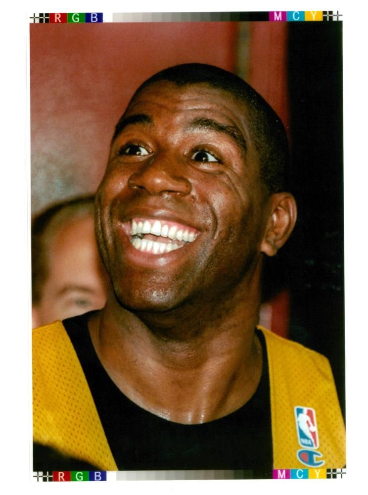 Magic Johnson American basketball player smiles as he announces he has rejoined the los angeles lakers. - Vintage Photograph