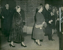 Queen Elizabeth The Queen Mother and Princess Margaret leaving the Twickenham. Walking with the Queen Mother is Col. J. Brunton, and on the left is Col. F. D. Prentice. - Vintage Photograph