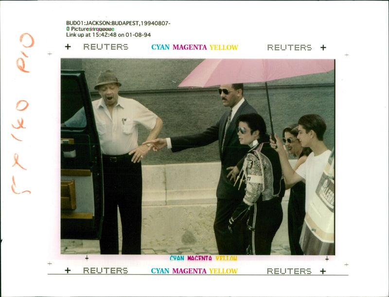Michael Jackson with Lisa Marie Presley-Jackson accompanied by their bodyguard. - Vintage Photograph