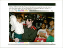 Michael Jackson with an unidentified child. - Vintage Photograph