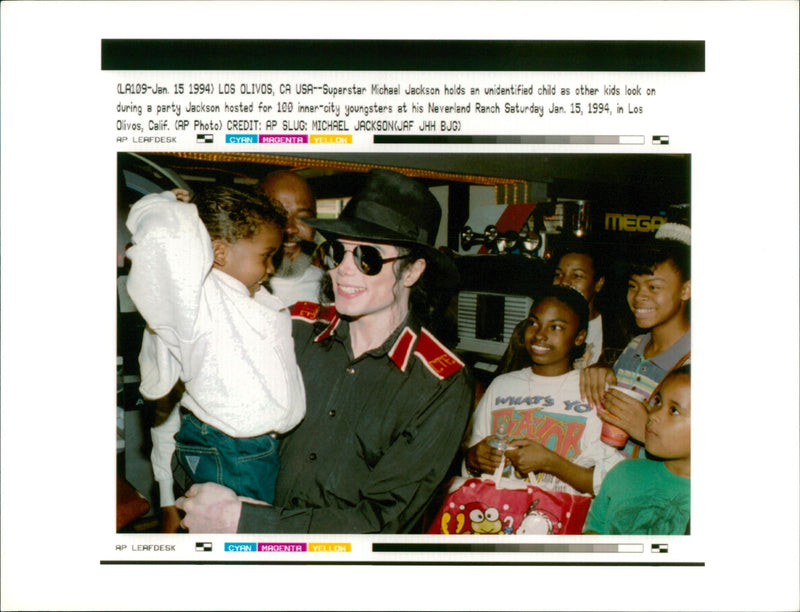 Michael Jackson with an unidentified child. - Vintage Photograph