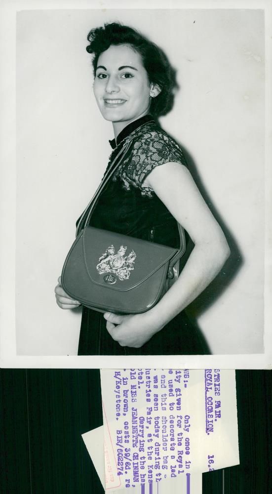 Queen Elizabeth II's Crown Procession 1953. Miss Jean shows a leather bag at Leather Goods Industries Fair. - Vintage Photograph