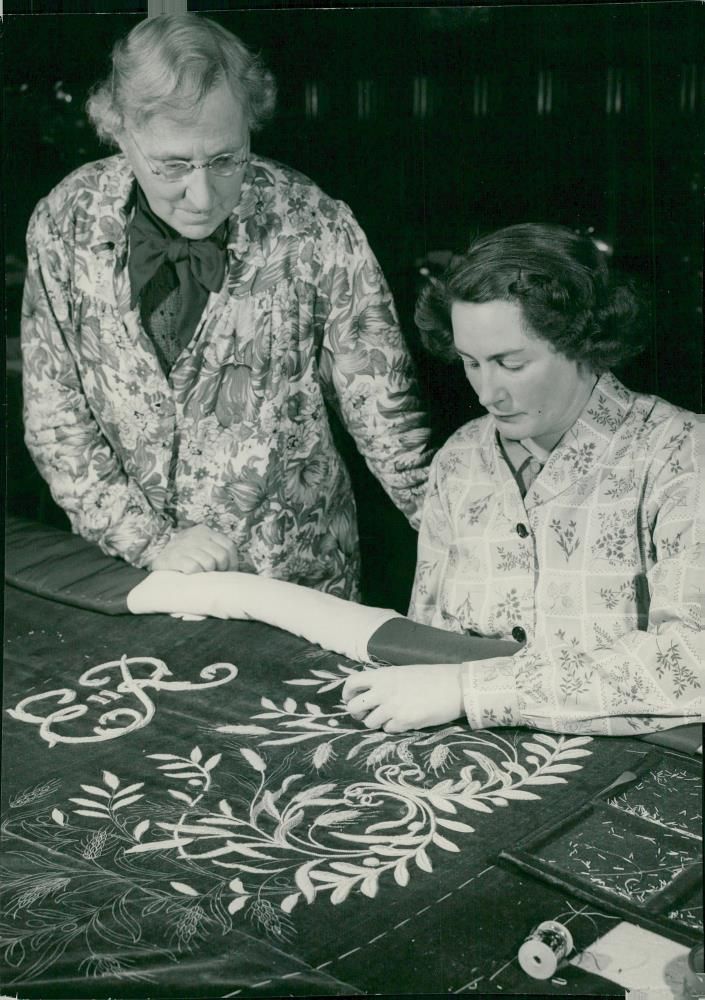 Queen Elizabeth II's Crown Procession in 1953. Queen Elizabeth's Revolt Jacket is being prepared. - Vintage Photograph