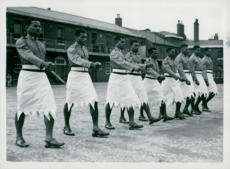 Queen Elizabeth II's Crown Procession 1953. Soldiers from the South Sea in front of the Crowning Celebrities. - Vintage Photograph