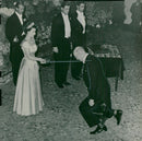 William Goodfellow bends a stumpy knee to Queen Elizabeth, when she in the city of Auckland dubs him to Knight - Vintage Photograph