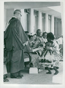 Queen Elizabeth receives a flower bouquet while visiting Fiji - Vintage Photograph