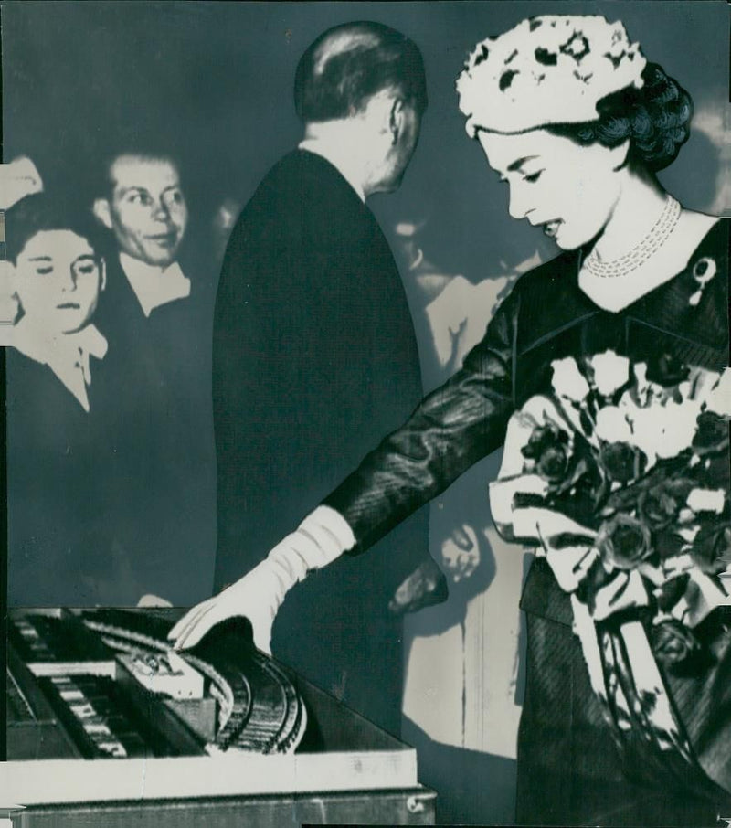 English State Visit in Paris. Queen Elizabeth is studying a model of metron - Vintage Photograph