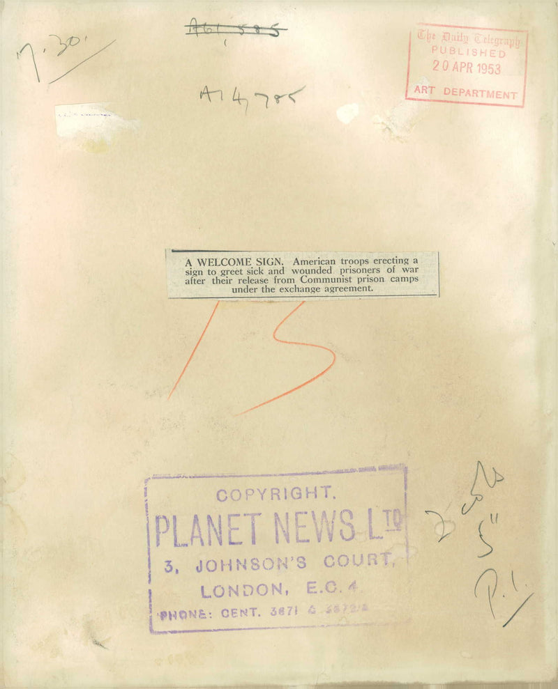 american troops erecting a sign to greet sick and wounded prisoners of war. - Vintage Photograph