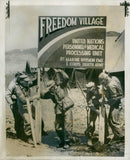 american troops erecting a sign to greet sick and wounded prisoners of war. - Vintage Photograph