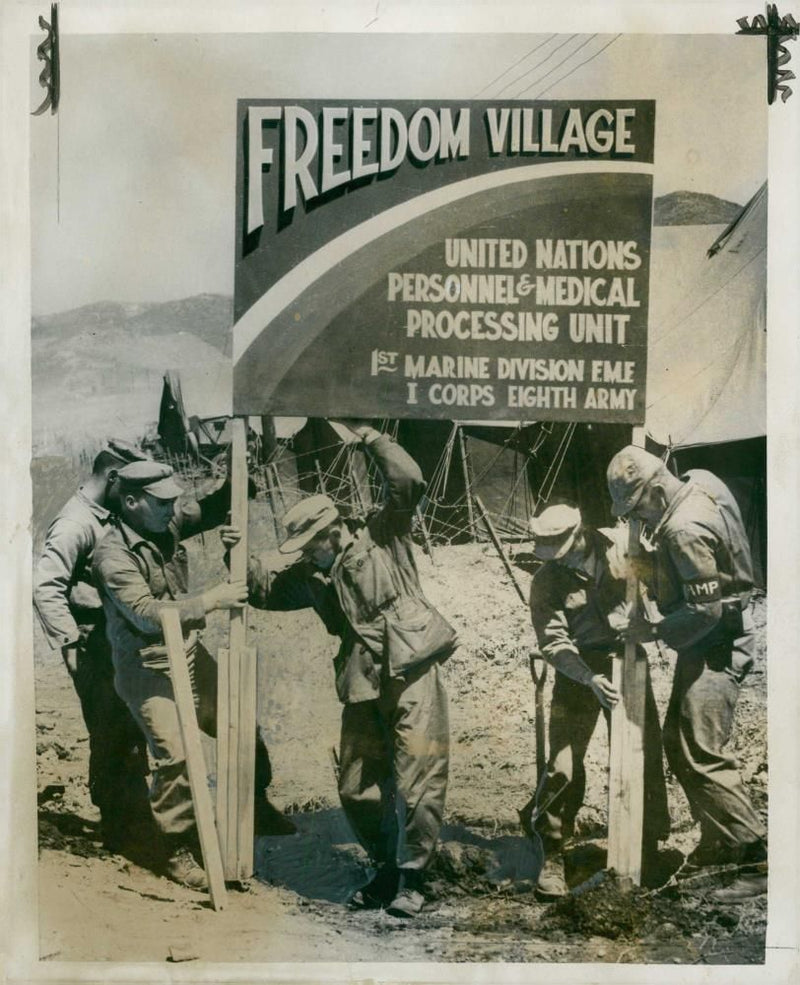 american troops erecting a sign to greet sick and wounded prisoners of war. - Vintage Photograph