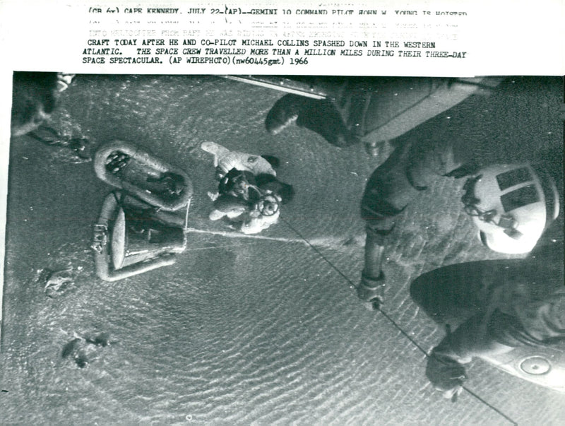 Gemini 10. Head of the game John Young is lifted up by the helicopter after landing - Vintage Photograph