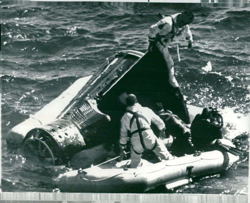 Charles Conrad has taken over to the rubber fleet from the canister after landing with Gemini 11 in the Atlantic - Vintage Photograph