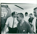Astronauts Virgil "Gus" Grissom and John Young leave the helicopter aboard the USS Intrepid - Vintage Photograph