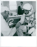 Astronaut Virgil I. Grissom gets his space suits controlled by a NASA technician - Vintage Photograph